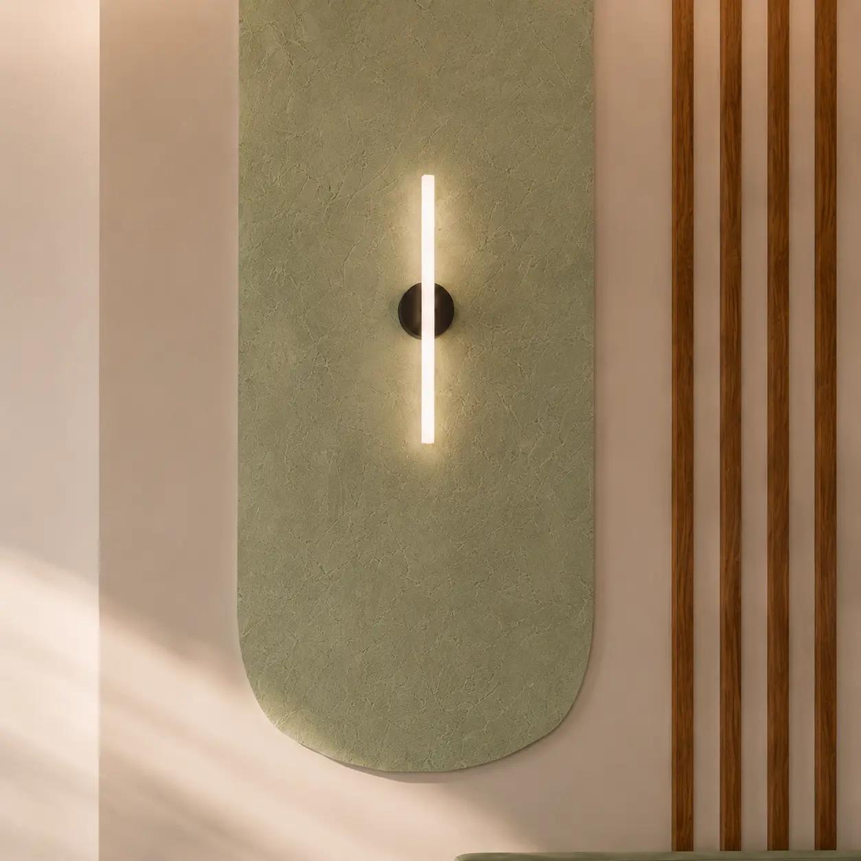 Linear wall light on a textured sage panel beside timber slats